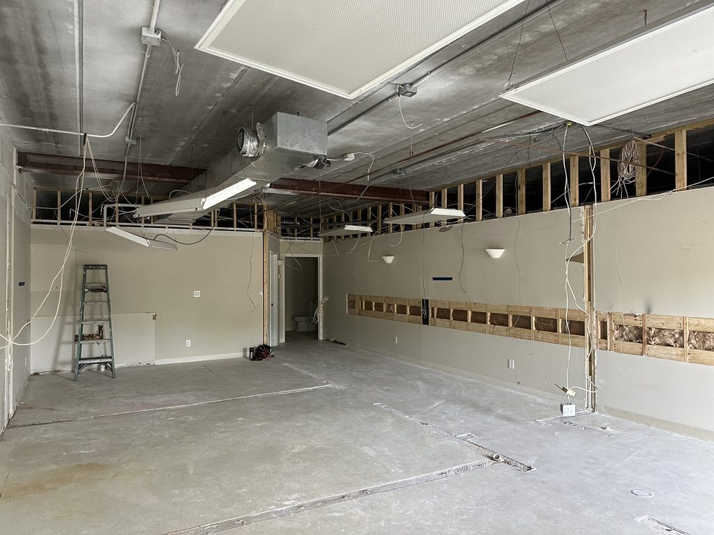 Before — room stripped to studs, mid-remodel wiring